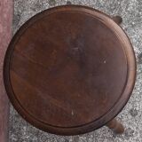 Tabouret bas tripode en bois.