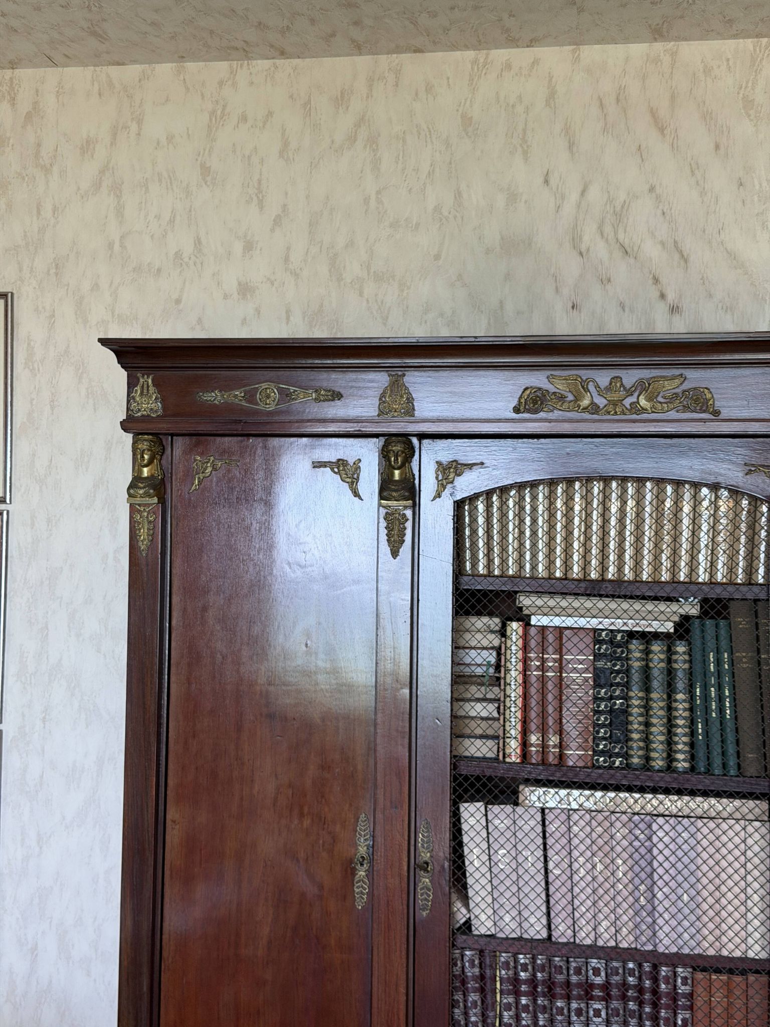 Large antique library from the Empire/Napoleon III period in mahogany and gilded bronze.