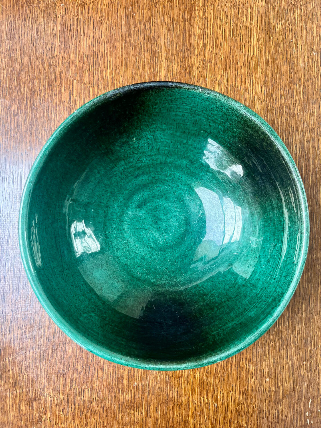 Green glazed ceramic bowl, signed Idlas.