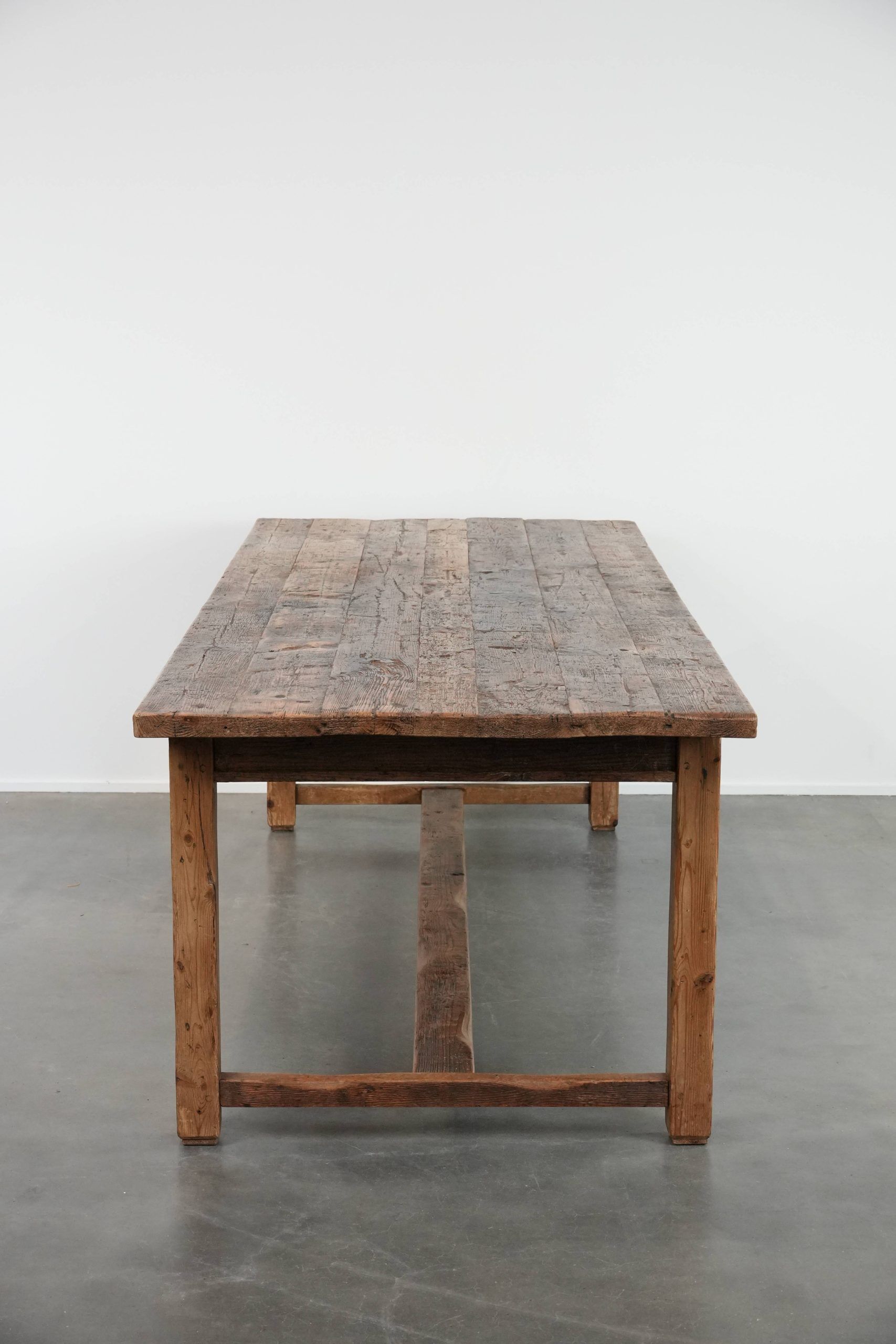 Magnificent and robust antique farmhouse dining table made of pine wood