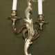 Pair of antique wall sconces from the 1920s in gilded bronze.