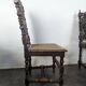 Set of 6 Henri II chairs in carved openwork oak with caned seats.