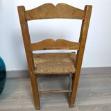 Vintage wooden and straw children's chair in a country style.
