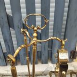 Brass fireplace set and its two andirons