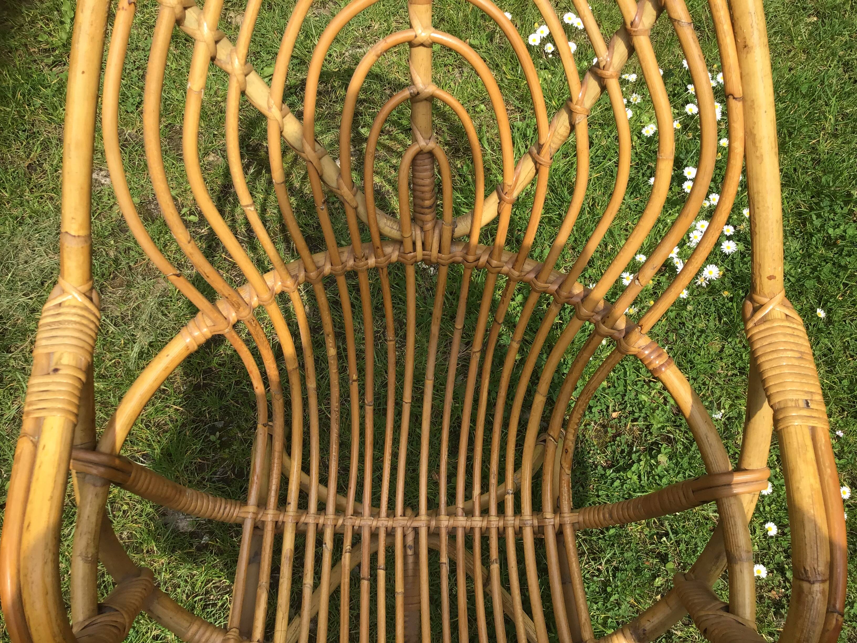 Vintage ovoid-shaped rattan armchair.