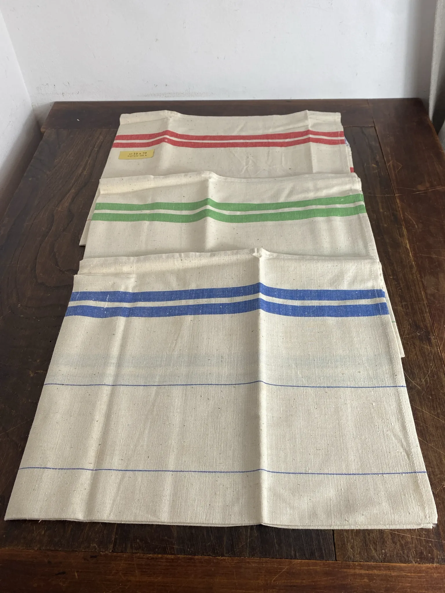 Three new multicoloured tea towels made of Cholet fabric, 100% cotton.