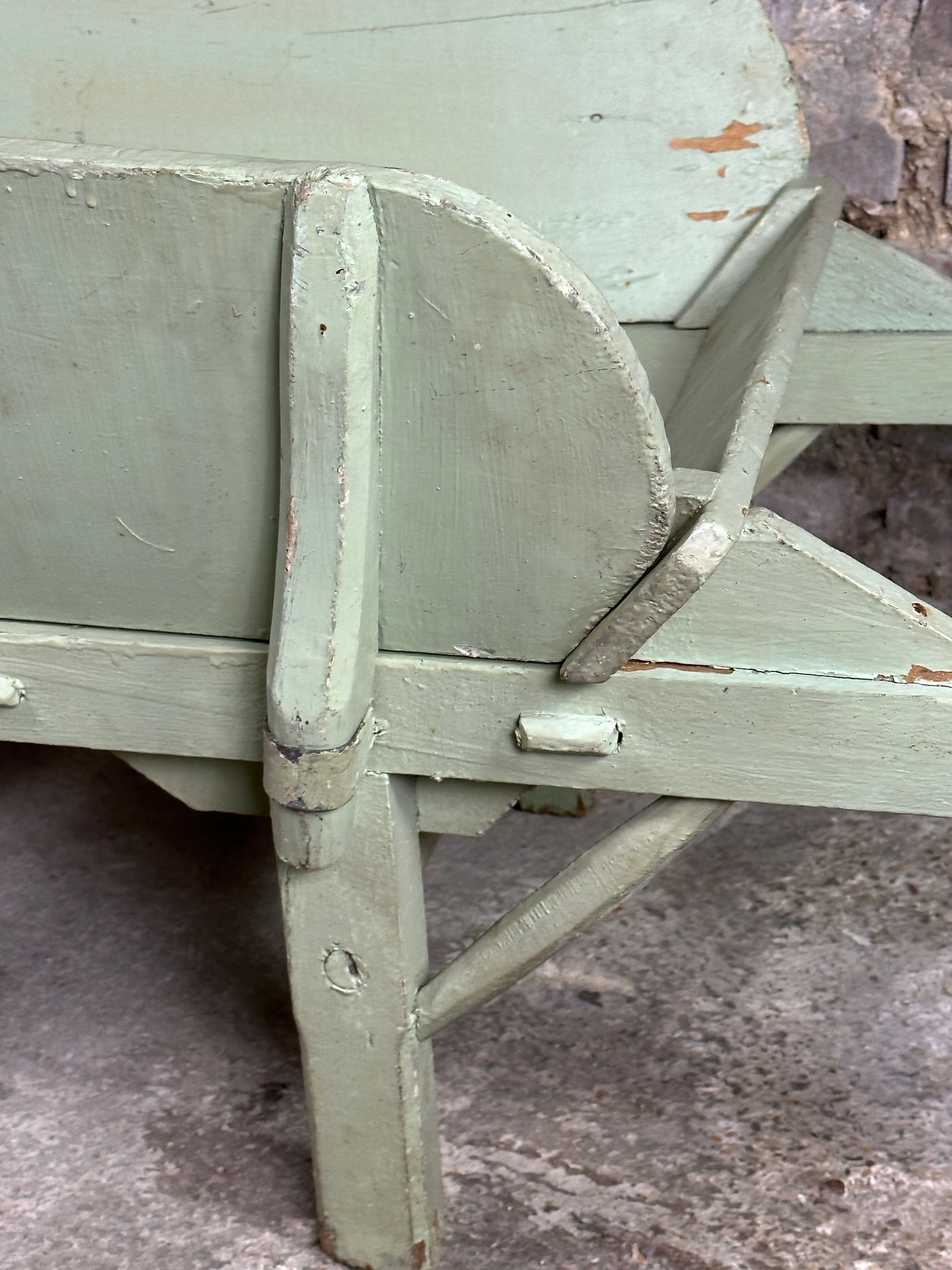 Antique wooden wheelbarrow