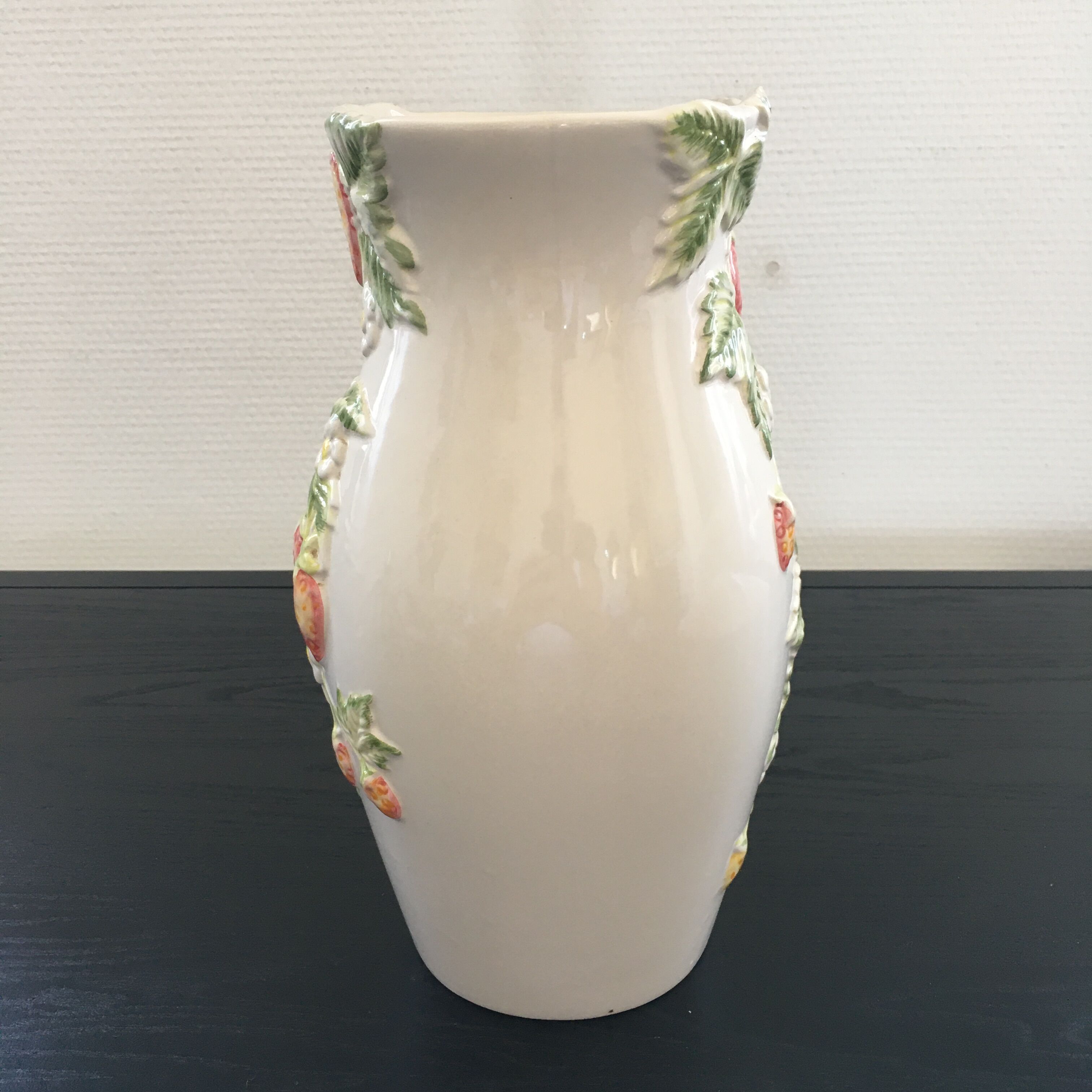 Vase decorated with strawberries in slip