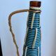 Scoubidou bottle with orange and blue and yellow brass handle 70s