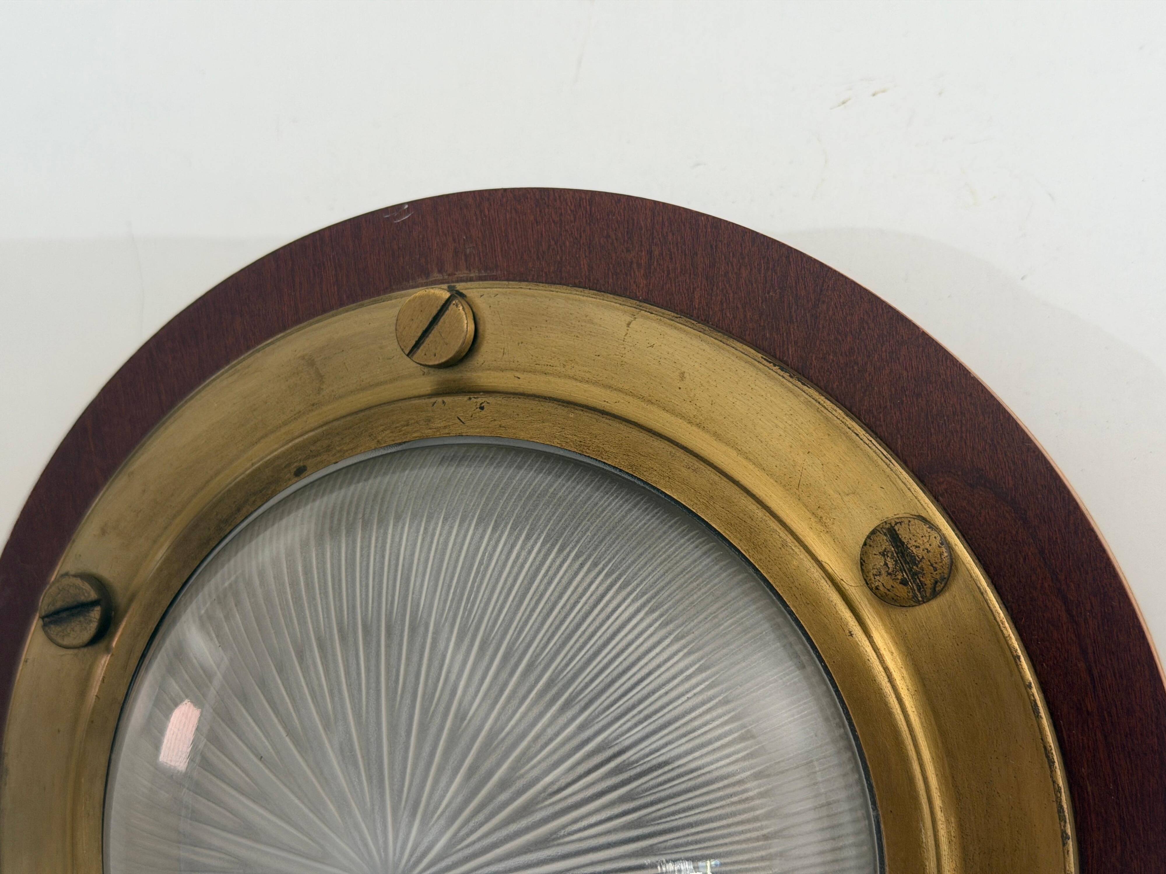 Pair of round glass wall lights, brass base and Wood Wood, 1960s, Italy.