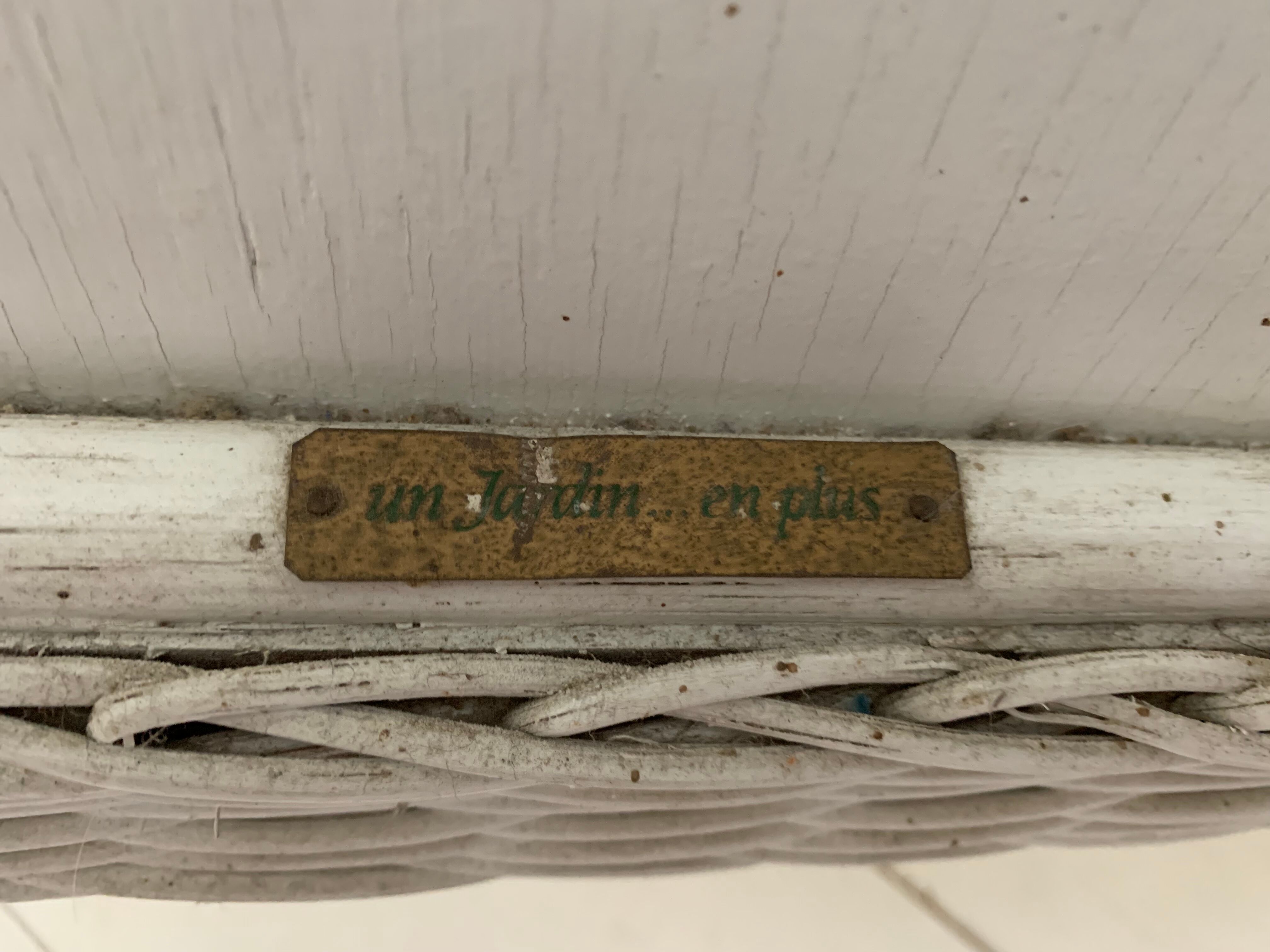 White dresser in vintage rattan