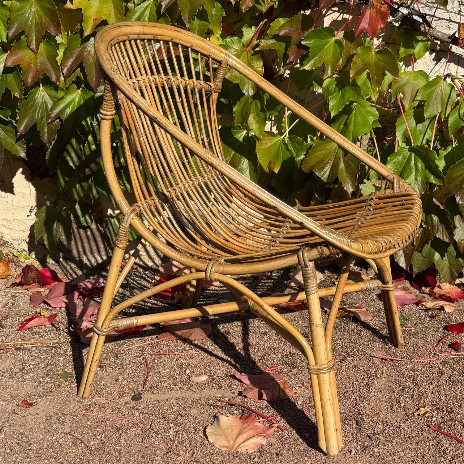 Pair of 1950s rattan armchairs from France.
