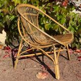 Pair of 1950s rattan armchairs from France.
