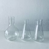 Set of three Pyrex glass chemistry bottles