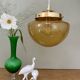 Vintage globe pendant light in bubbled amber glass