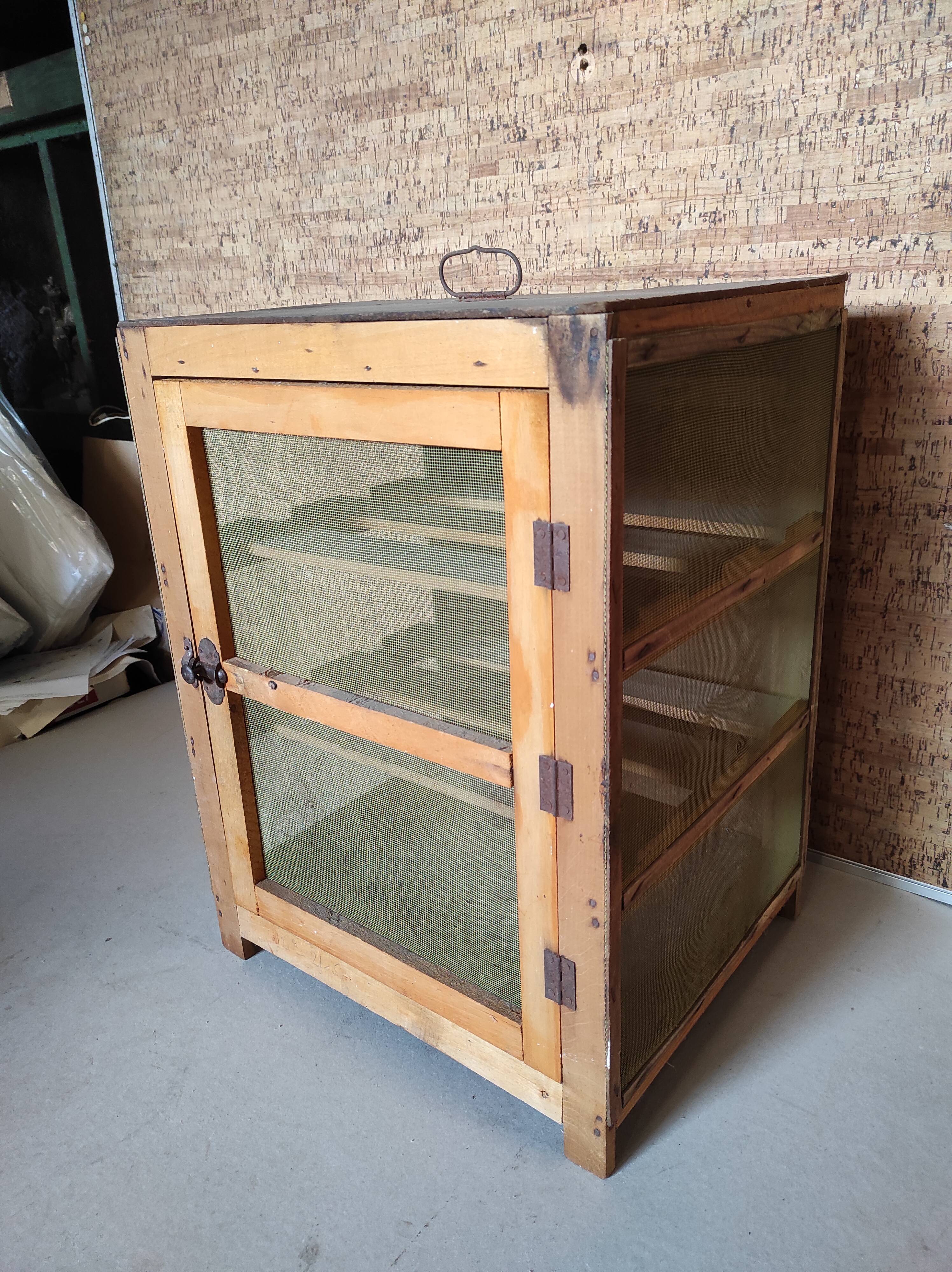 Small pantry cabinet in vintage wood mesh