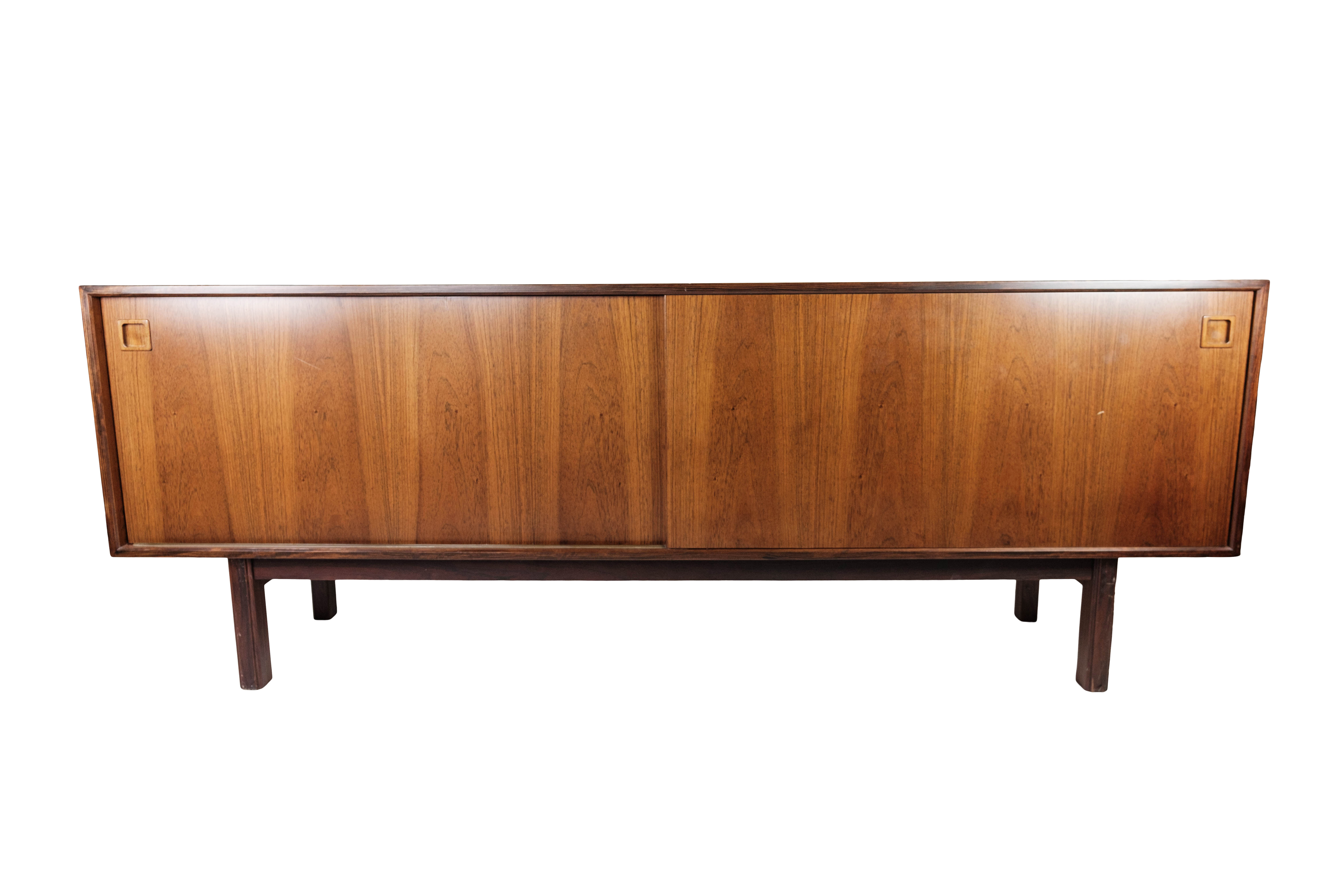 Sideboard in rosewood with sliding doors designed by Omann Junior from the 1960s.