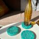 Dessous de bouteilles/carafes en céramique verte, vintages