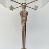Art Nouveau style lamp, in bronze and frosted glass.