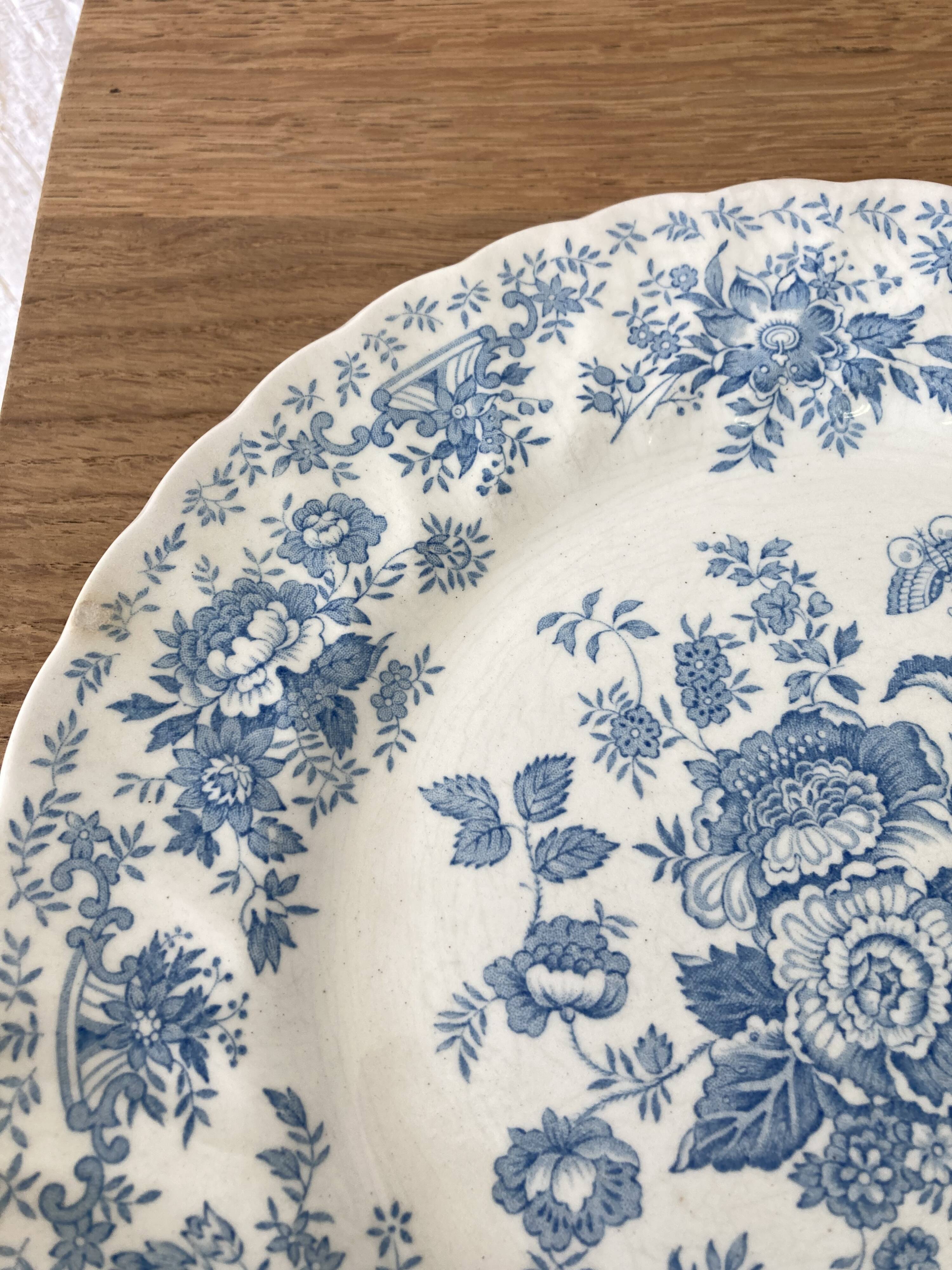 Four old blue plates