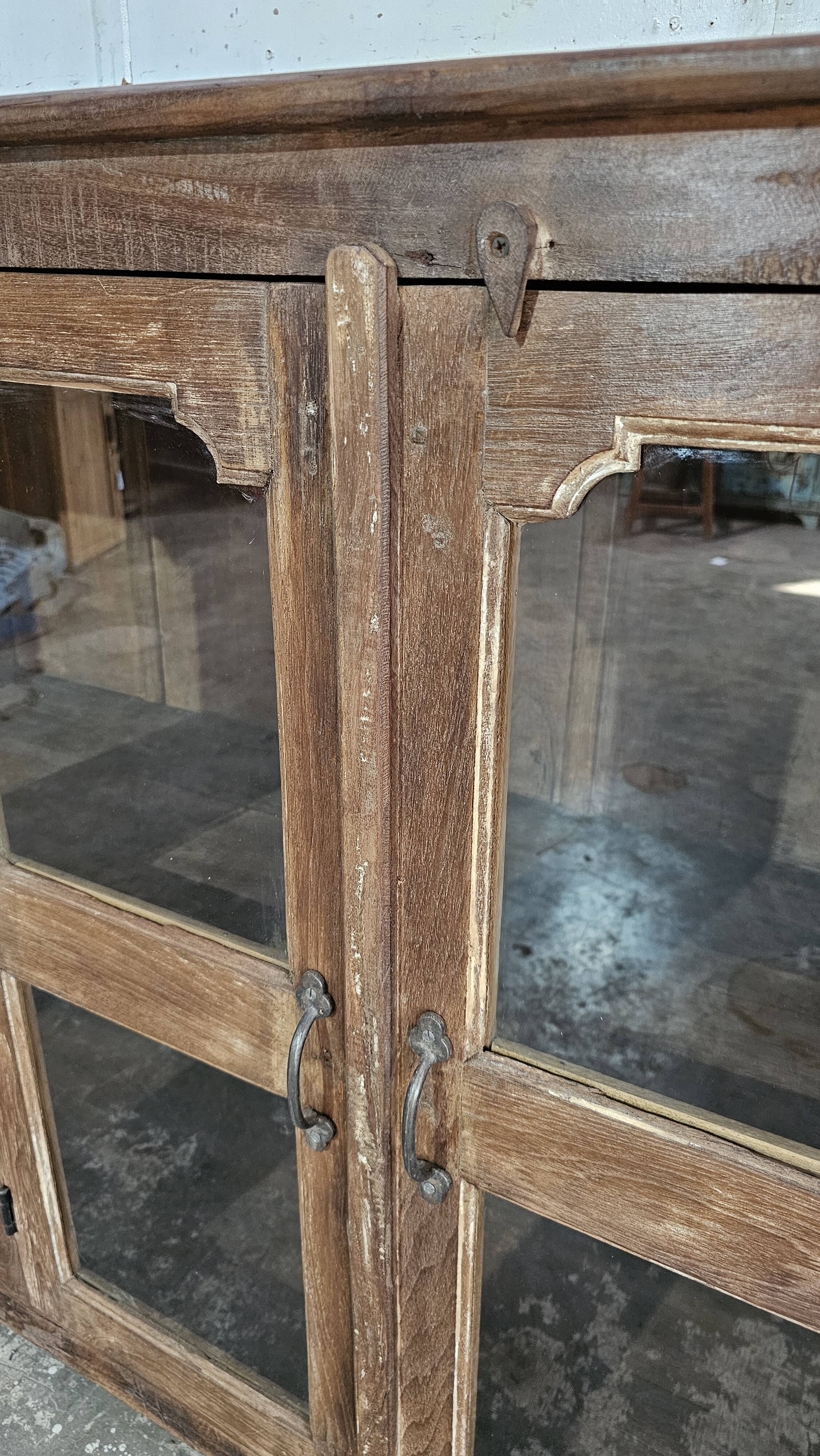 Antique glass-fronted buffet in Burmese teak
