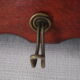 Red wooden wall-mounted coat rack and Art Deco mirror