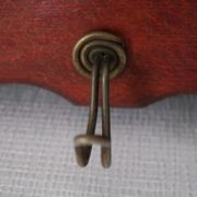 Red wooden wall-mounted coat rack and Art Deco mirror