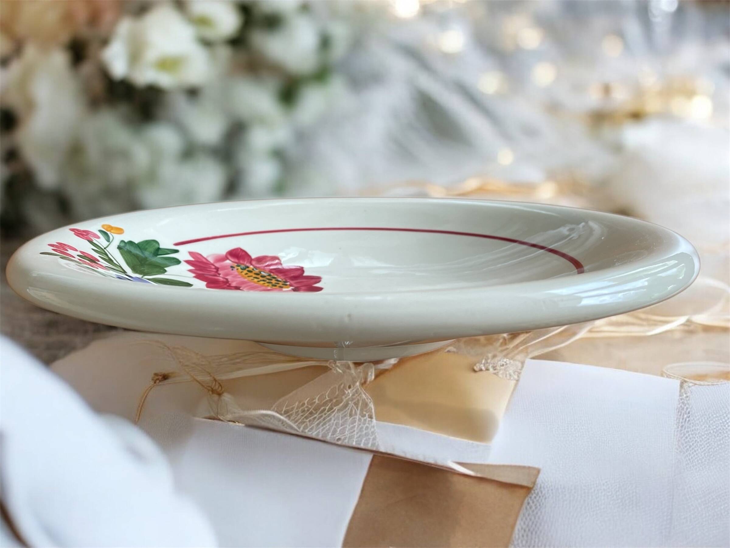 Large antique salad bowl on a pedestal, made of Sarreguemines earthenware.