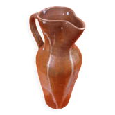 Glazed stoneware pitcher With white dripping on brown background Height: 270mm