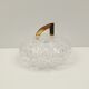 Round crystal box and a golden metal handle