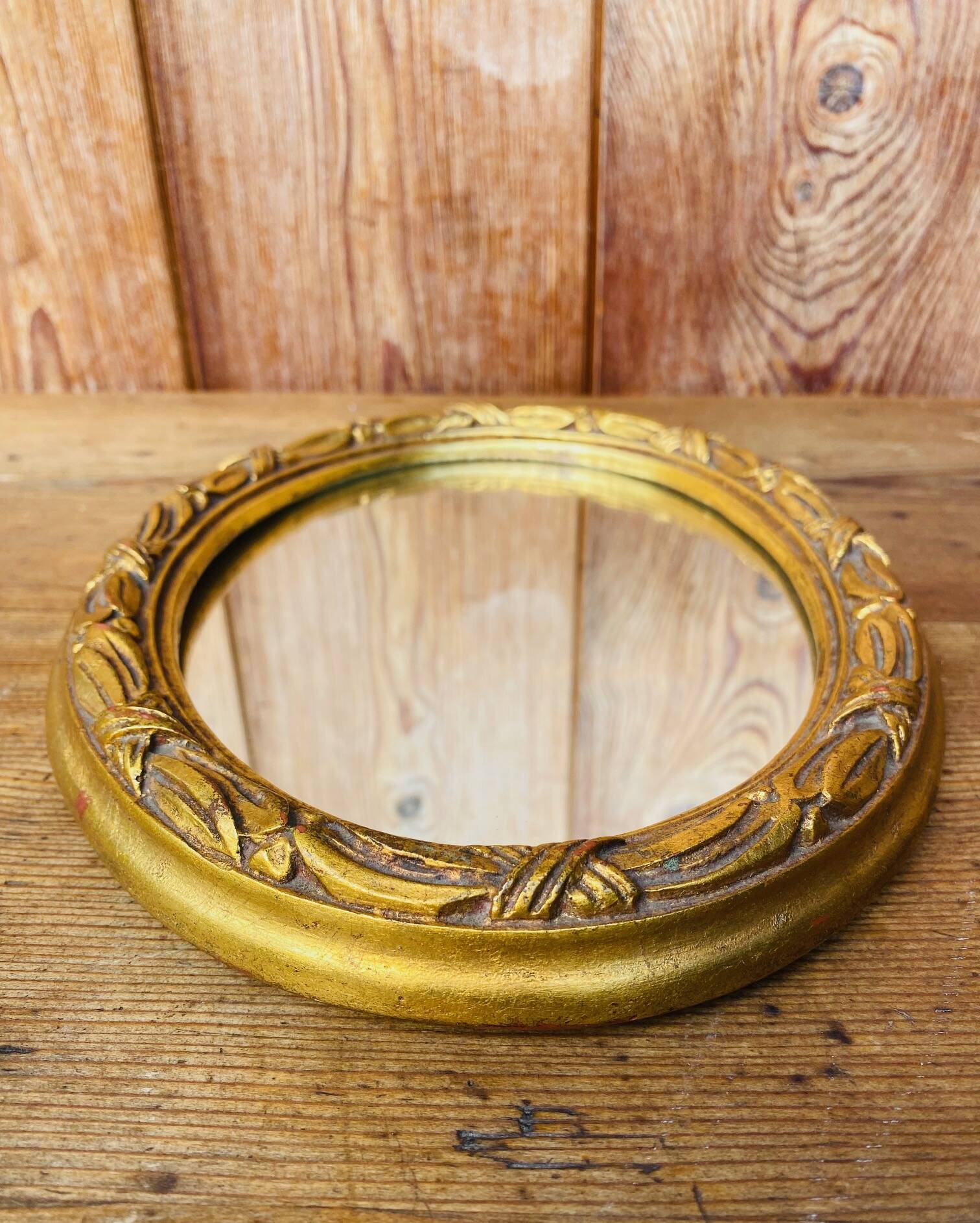 Small antique oval gilt mirror