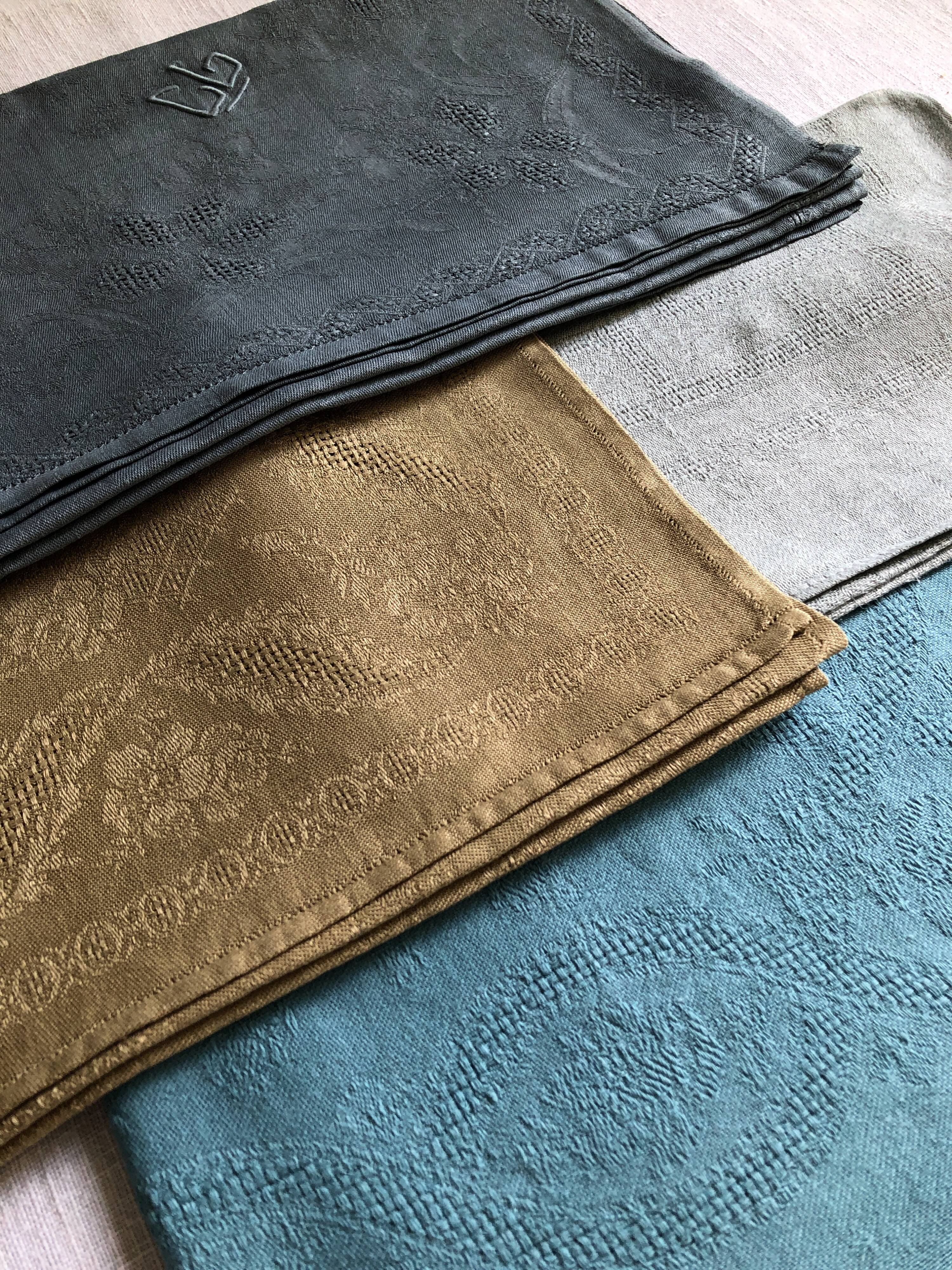 Suite of four tinted antique napkins