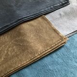 Suite of four tinted antique napkins