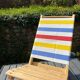 Folding chair in wood and striped fabric