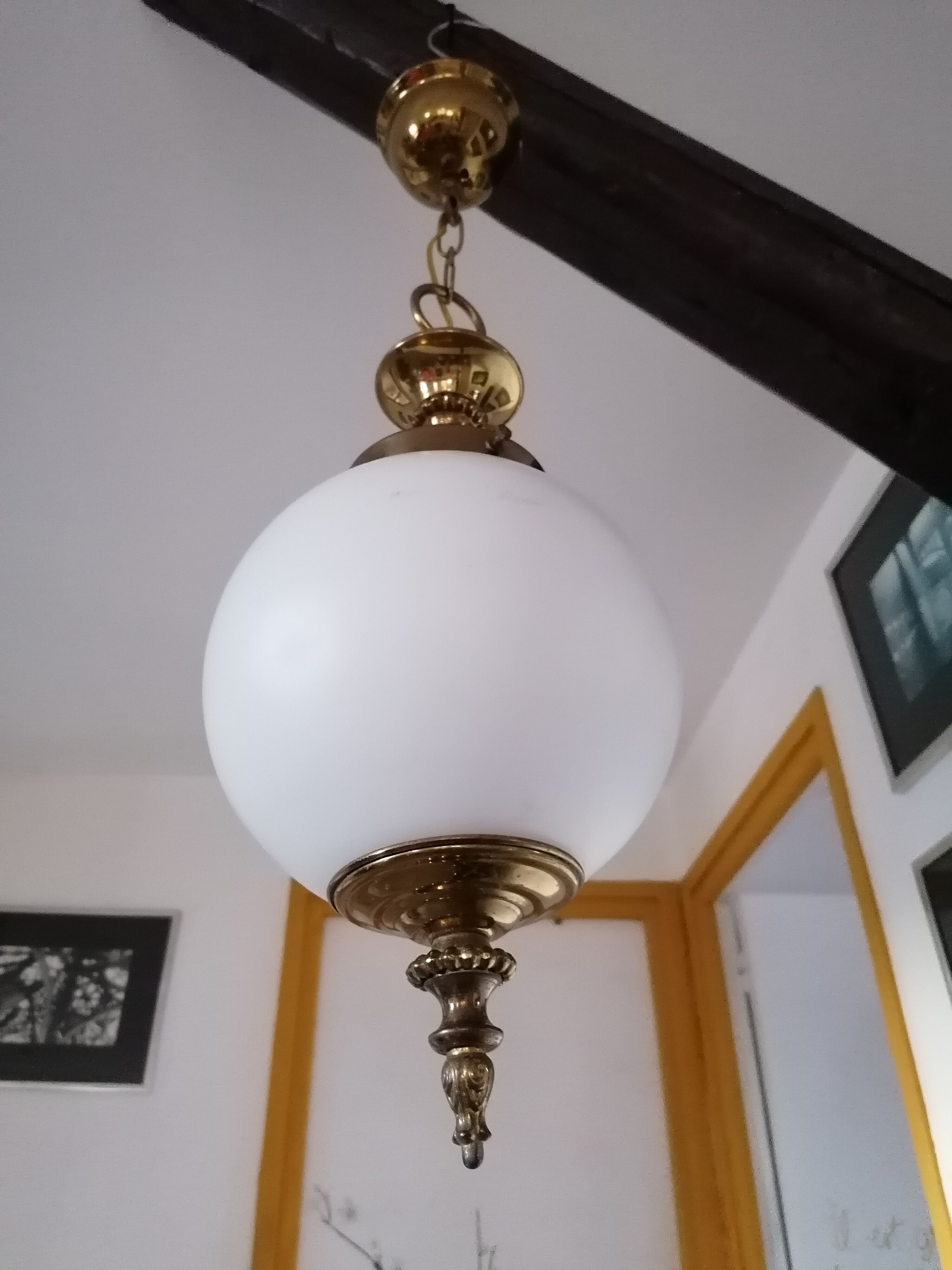 Golden metal and opaline glass globe