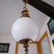 Golden metal and opaline glass globe