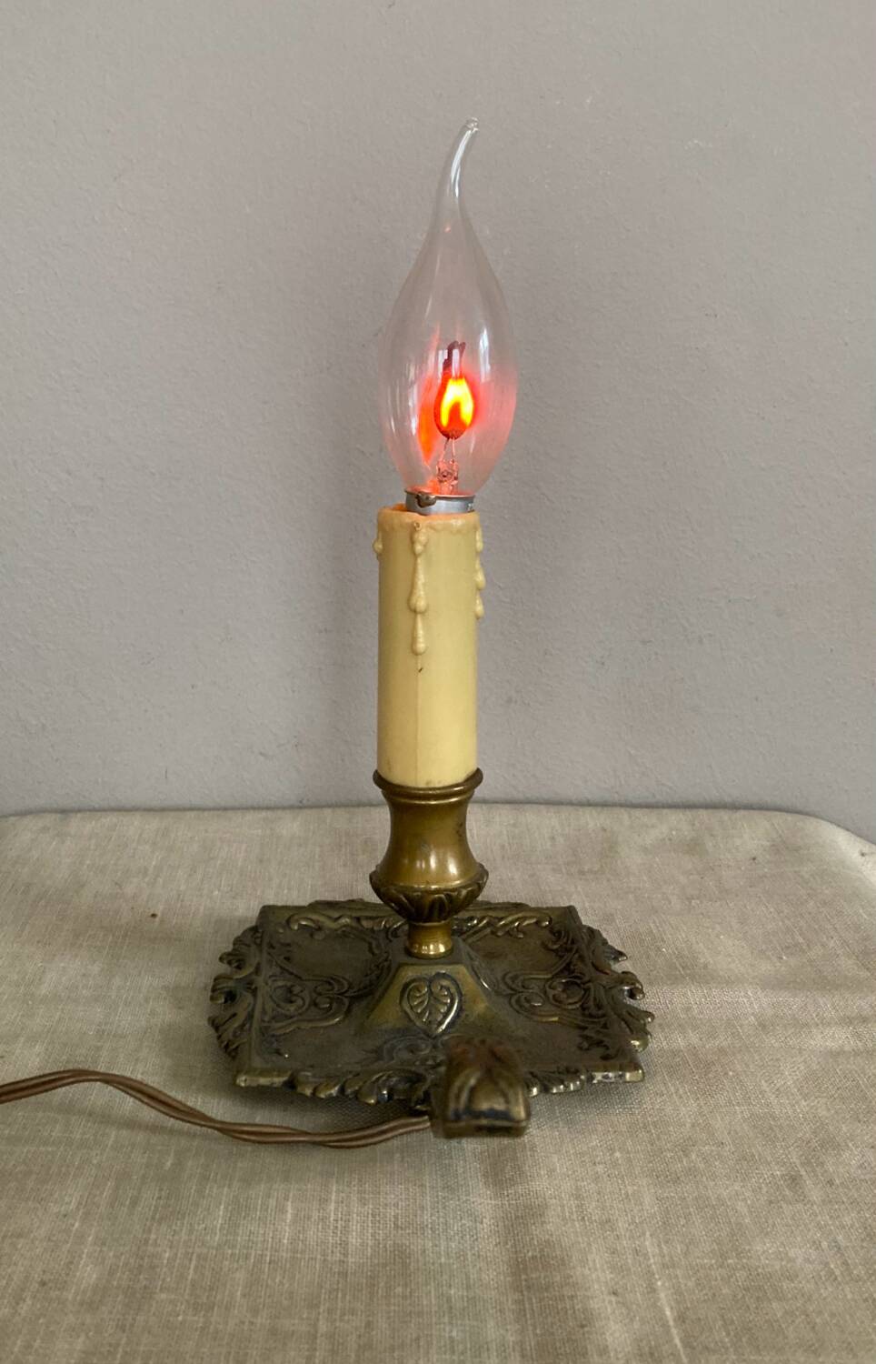 Candle holder with 20th century spelter socket mounted as a flame bulb lamp