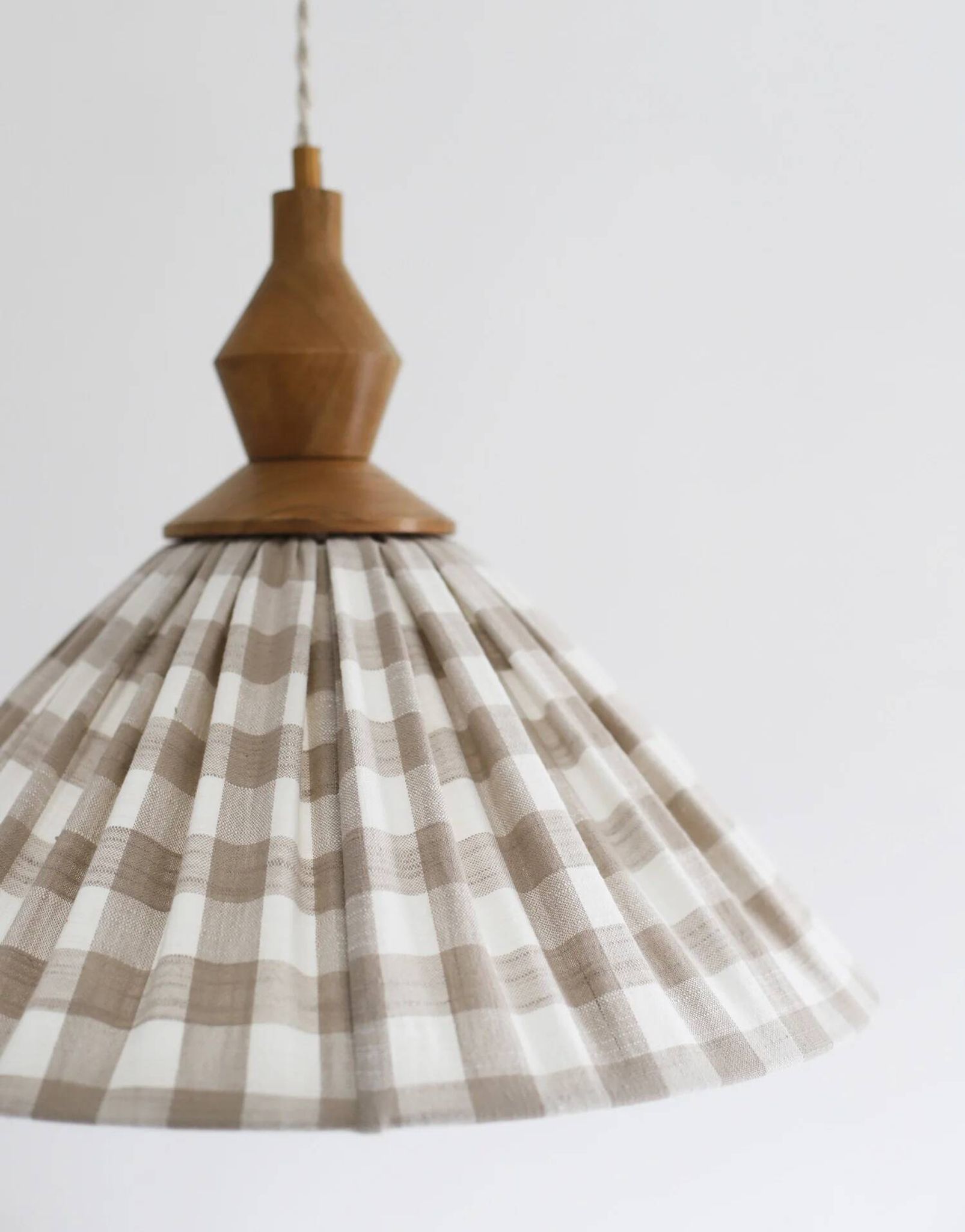 "Olga" pleated pendant light in beige checked fabric and turned wood finish
