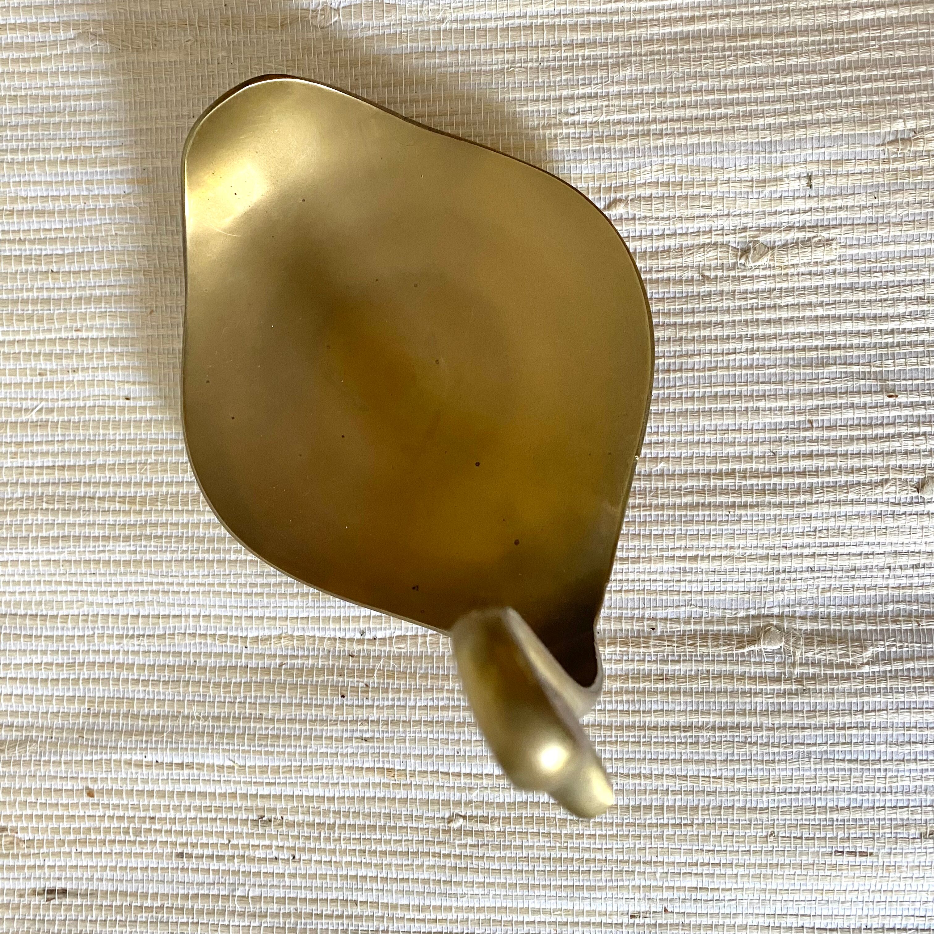 Empty brass swan pocket