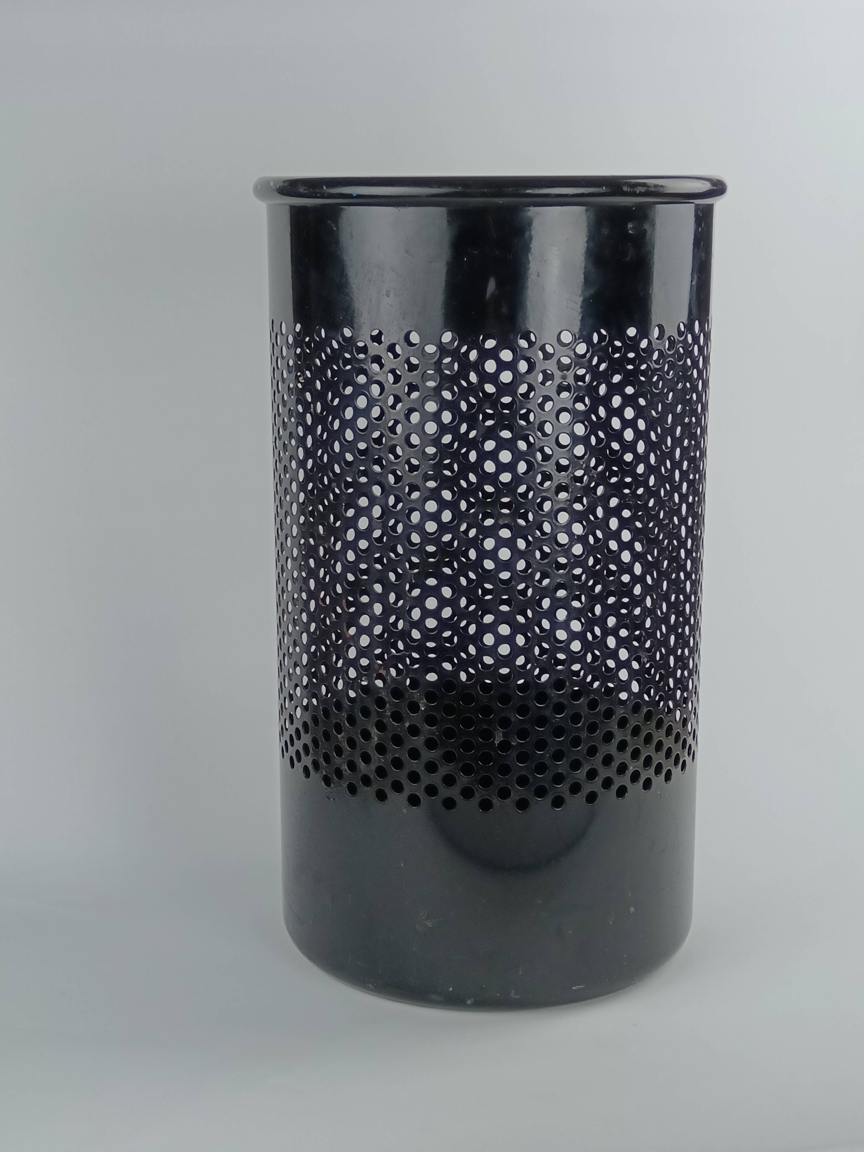 Perforated metal wastebasket