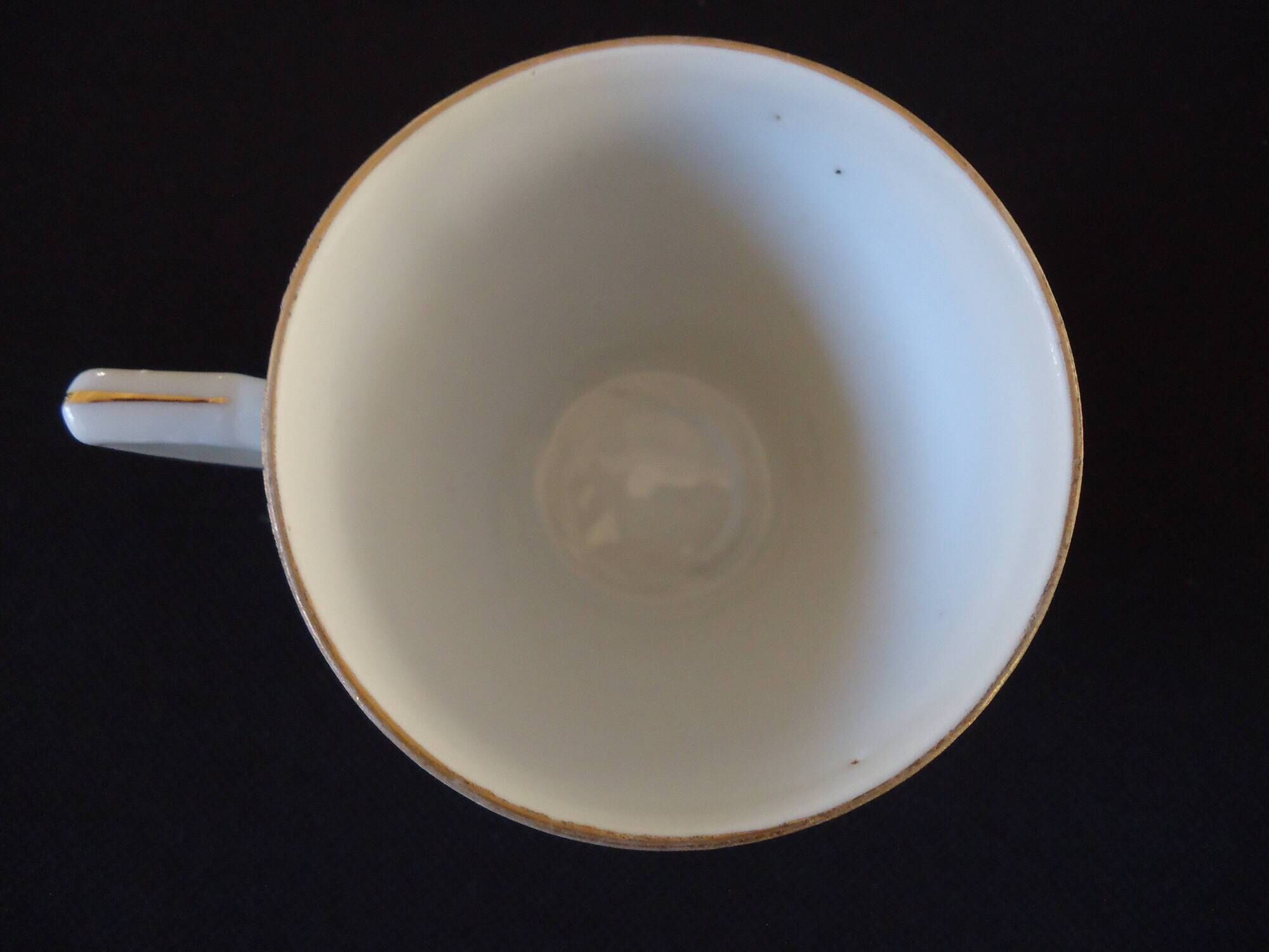 Set of six Art Deco white fine porcelain coffee cups and saucers