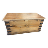 Old trunk in natural pine wood with padded interior