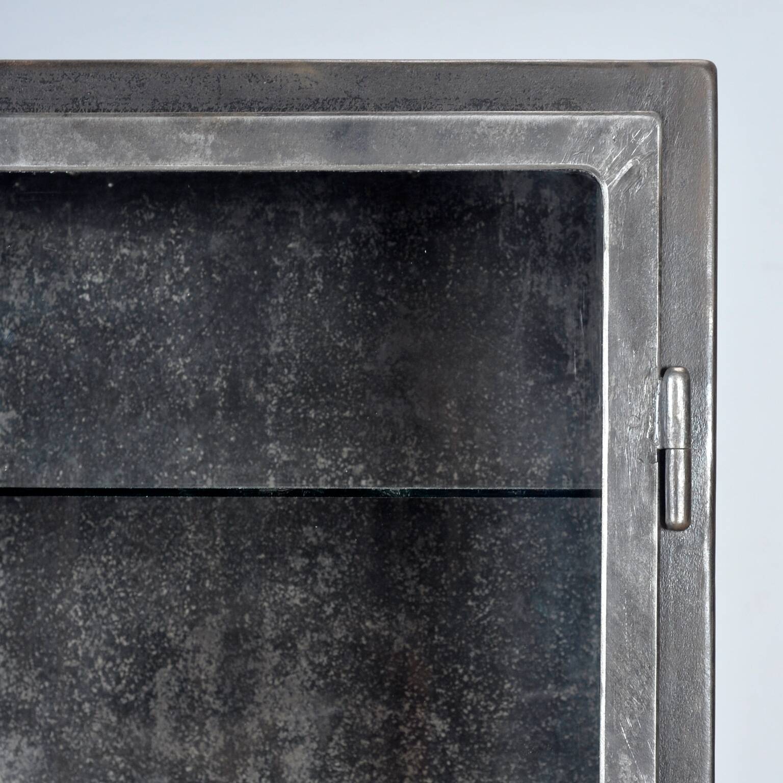 Polished iron medical cabinet, 1930s