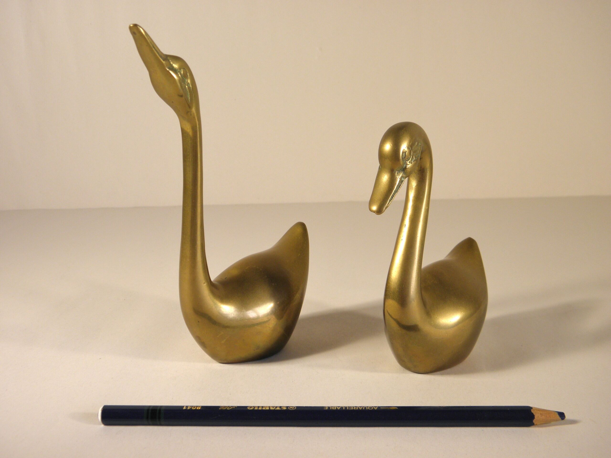 Pair of brass swans