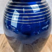 Antique cobalt blue glass vase with golden filigree.