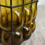 Glass carafe encased in wrought iron