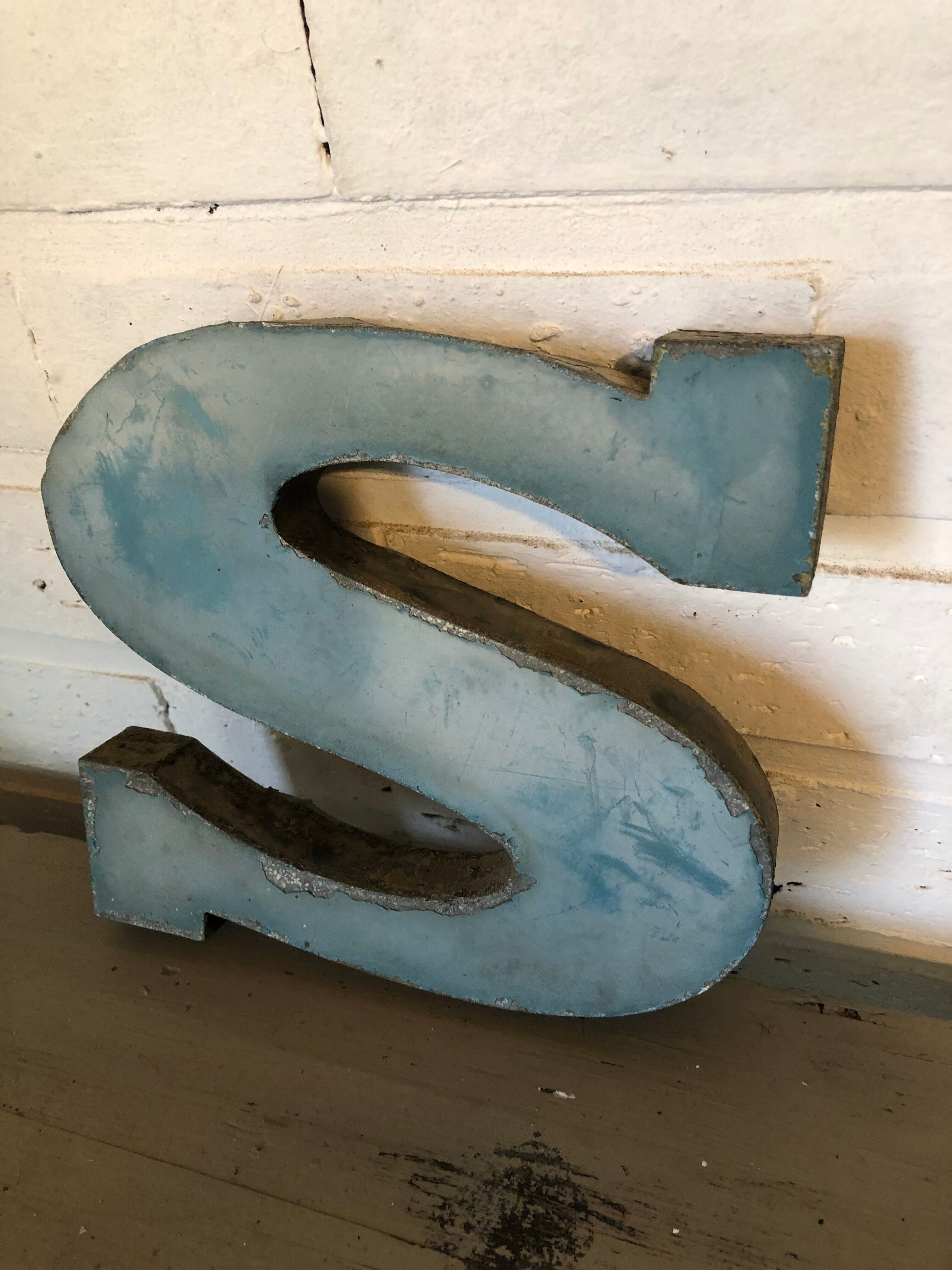 Blue sign letter "S"