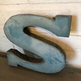 Blue sign letter "S"