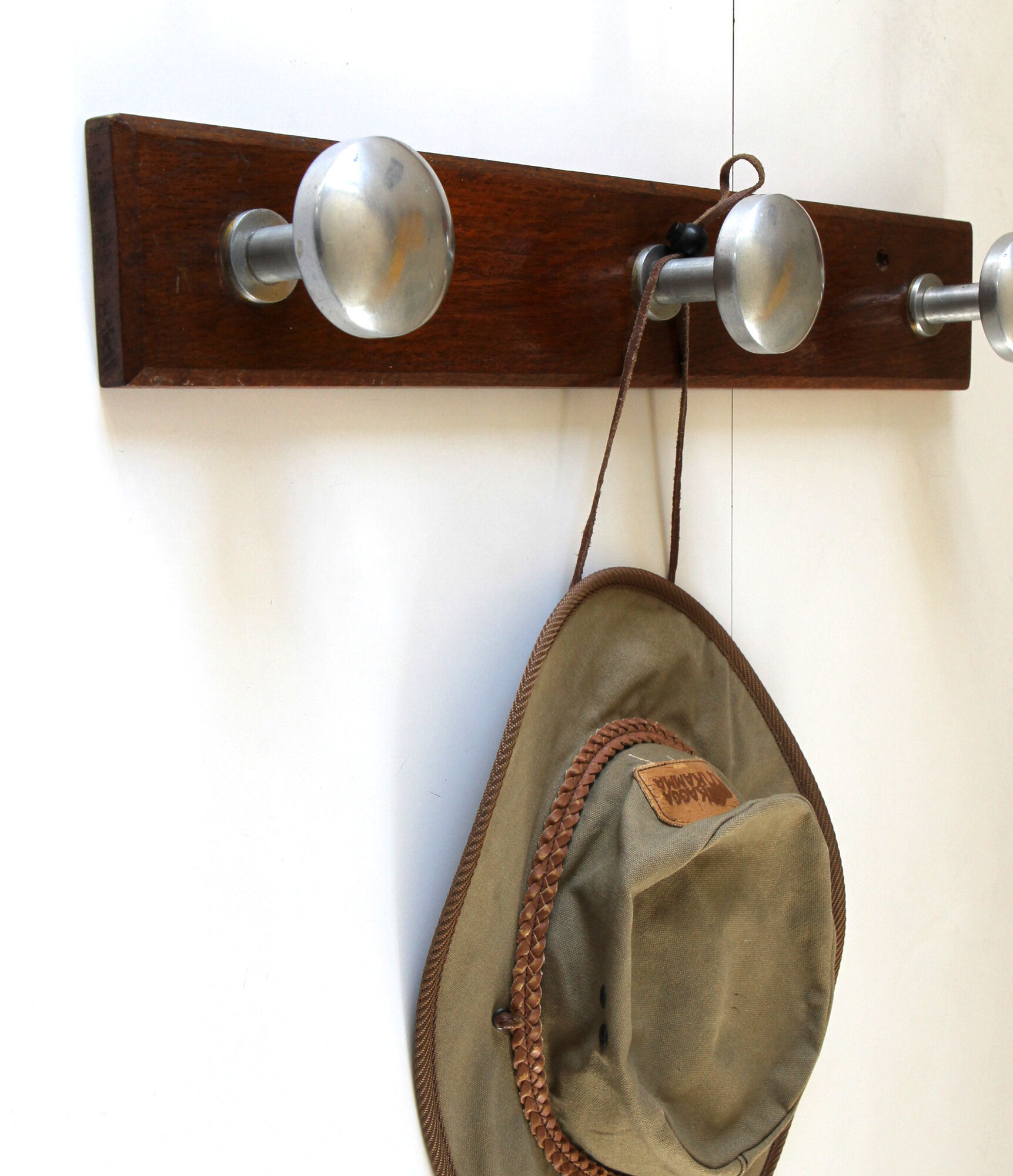 Wooden and stainless steel coat holders from the 1920s