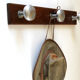 Wooden and stainless steel coat holders from the 1920s